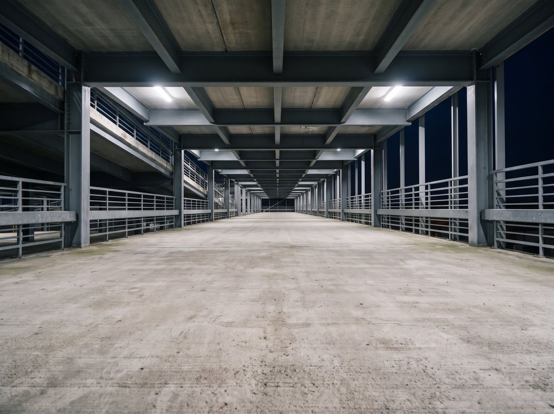 The same parking structure lit after dark